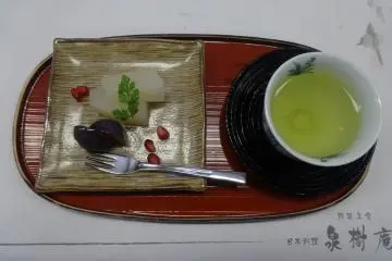 <p>Green tea and a tasty dessert</p>