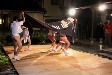 <p>Lion Dance performed on a temporary stage set in a garden of a newly-built house</p>