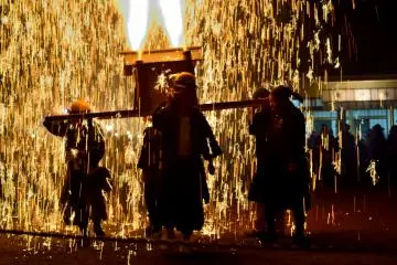 Even mikoshi (portable shrines) are configured with fireworks that cascade down.