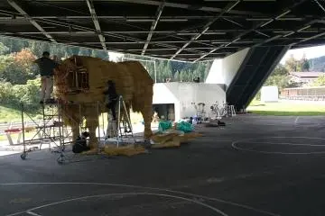 <p>A giant straw animal under construction</p>