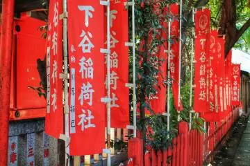 <p>Red flags with the name of the shrine</p>