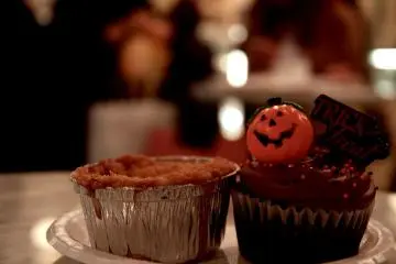 A delicious and traditional apple pie (left) and a Halloween themed chocolate cupcake (right)