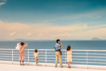 A family enjoys the fresh clean air on their voyage