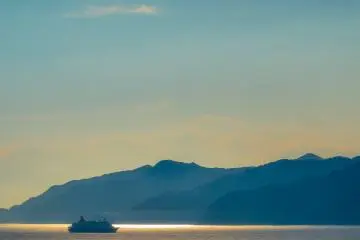 A distant ferry enjoying the clear Japanese waters