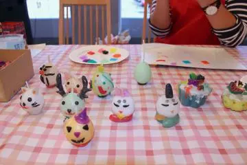 <p>An assortment of candles made by previous participants</p>