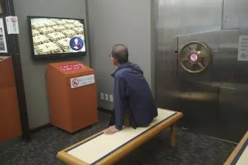 Next to the door of the big safe there is a video that shows how money was made both in the old days and in modern times