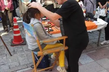 <p>There are face-painters and make-up booths along the main shopping street</p>