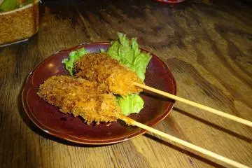 <p>Fried meat on a stick called kushi katsu.</p>
