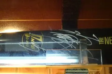 <p>A bat signed by the athlete, Matsuda</p>
