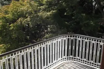 <p>The balcony has a view of the garden and the castle</p>