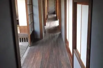 <p>Another wooden-floored passage</p>