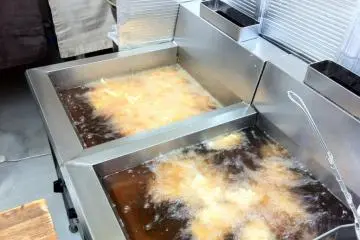Here fries two orders of chicken and french fries