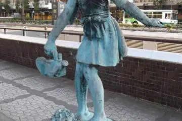 <p>Watering her plant</p>