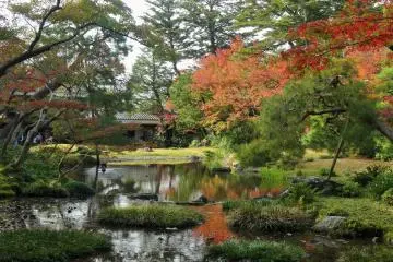 <p>It's worth walking around to the rear of the garden for a photo of the villa through the foliage</p>