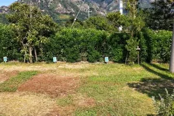 A camping plot with mountains behind