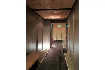 <p>A hallway that leads to the private baths.</p>