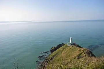 Looking down at the lighthouse from the first false-summit