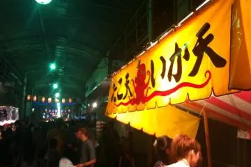How about some octopus or squid tempura? Food stalls go well into the covered arcade