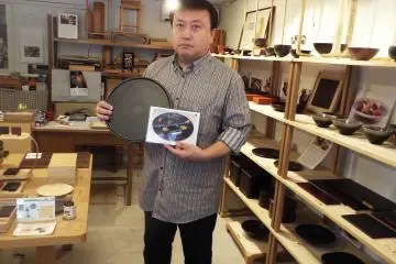 Mr. Kirimoto displaying his work
