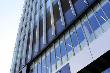 <p>The 15-story building stands so high that you need to crane your neck up to see the top-most part</p>
