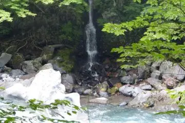 A small falls comes down in front of the prayer platform