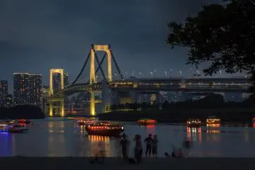 <p>View from Odaiba after sunset, with Yakatabune pleasure boats in front of the Rainbow Bridge</p>
