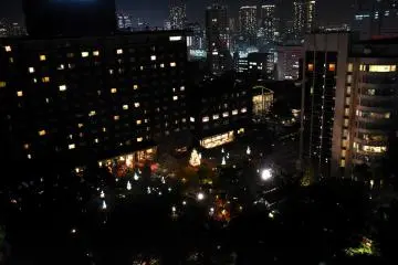 Christmas illumination in the hotel garden viewed from a guest room balcony
