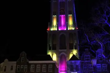 <p>Tourists were looking up at the beautifully-lit tower with awe from the bridge</p>
