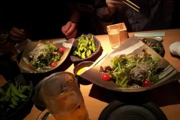 Not everything is fried: salad with shirasu, sake, beer, edamame... (Photo: KWHedlund)