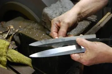 Knives at different stages of polishing