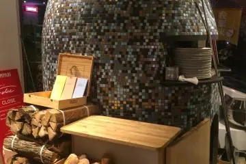 The stone oven used to cook the pizza and bread.