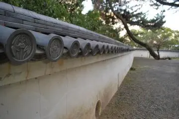 From behind the castle's walls