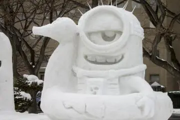A minion in an inner tube at the snow festival
