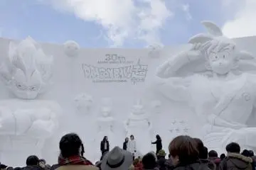 A tower Goku stands watch over the festival