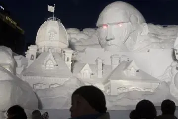 A massive sculpture depicting characters from the anime Attack on Titan