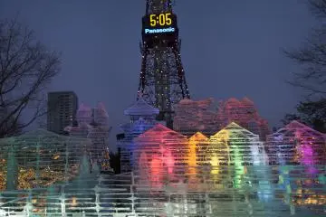 Beautiful ice sculpture illuminated against the Sapporo TV Tower
