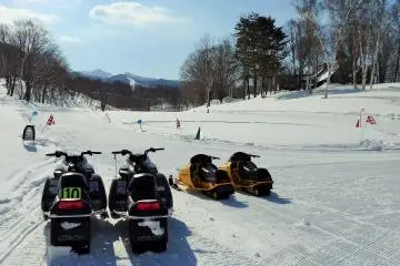 Thrill seekers can speed around this snowmobiling course.