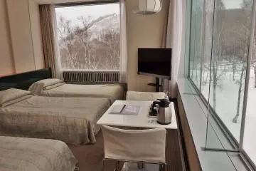 There are rooms to suit every budget.  This is a simple triple room with great windows.