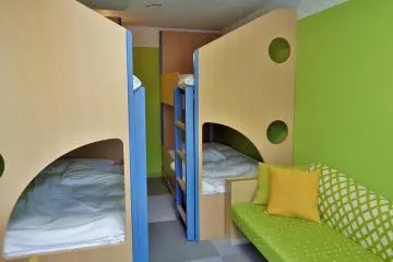 The 4-bunk bed room is popular with families with children.