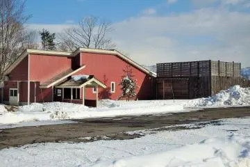 The rotemburo (open-air bath) is across the parking lot in this building.