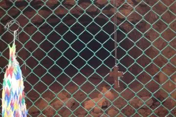 At the far end of the section of tunnel open to visitors, I found a cross and a number of paper cranes left by visitors as expressions of peace.