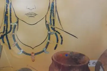 Tubular stone beads were found like depicted here, (museum exhibit)