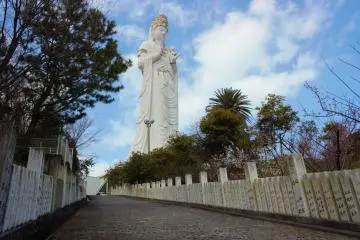 After you park your car, you must walk up a short hill to the statue and temple