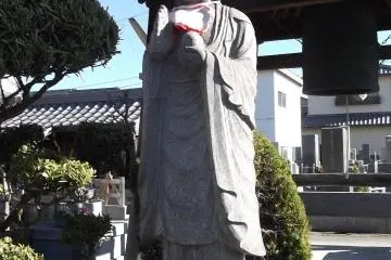 A devotee minding the bell