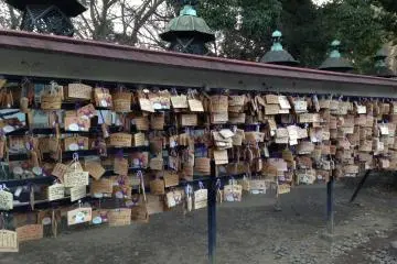 In front of the garden wall, the temple's votive tablets