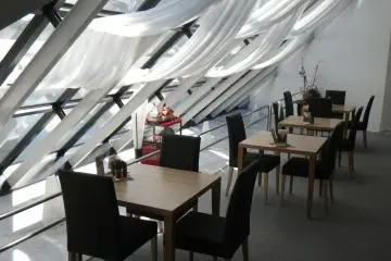 Quiet, relaxing coffee shop where you can order a meal set, drinks or dessert. At the time I visited, the Y1,000 lunch combo consisted of sauteed chicken with sauce, a side of salad greens, mushroom soup, rice, cake and tea or coffee. You could also try a dessert set -  chocolate cake, fresh fruit and ice-cream or pancakes with tea or coffee