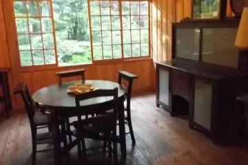 <p>The dining room, still laid out for tea</p>