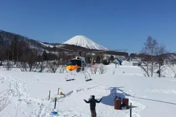 The helicopter landing with Mt Yotei in the background
