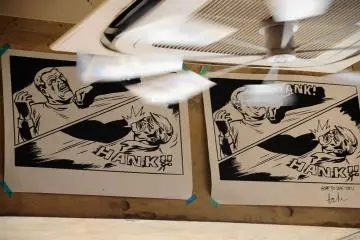 The decor is full of kitschy objects and comic art