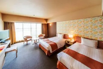 Twin rooms with a lounge and balcony